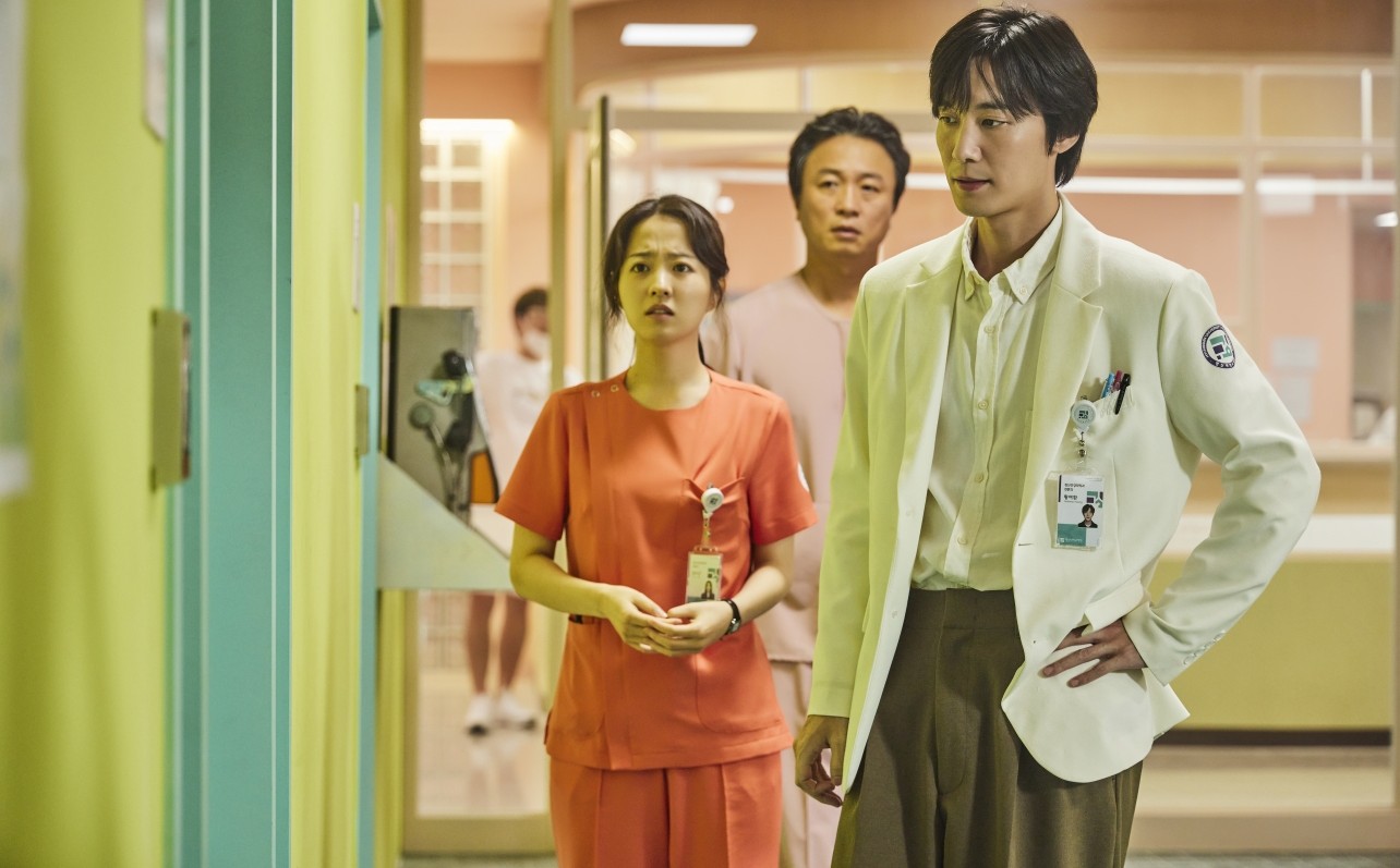 Three hospital workers look concerned in Daily Dose of Sunshine.