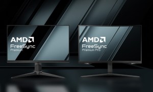 Two monitors with AMD FreeSync over a dark background.