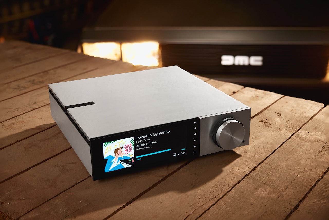 The Cambridge Audio Evo 150 DeLorean Edition integrated amplifier and network streamer, with a DeLorean DMC-12 in the background.