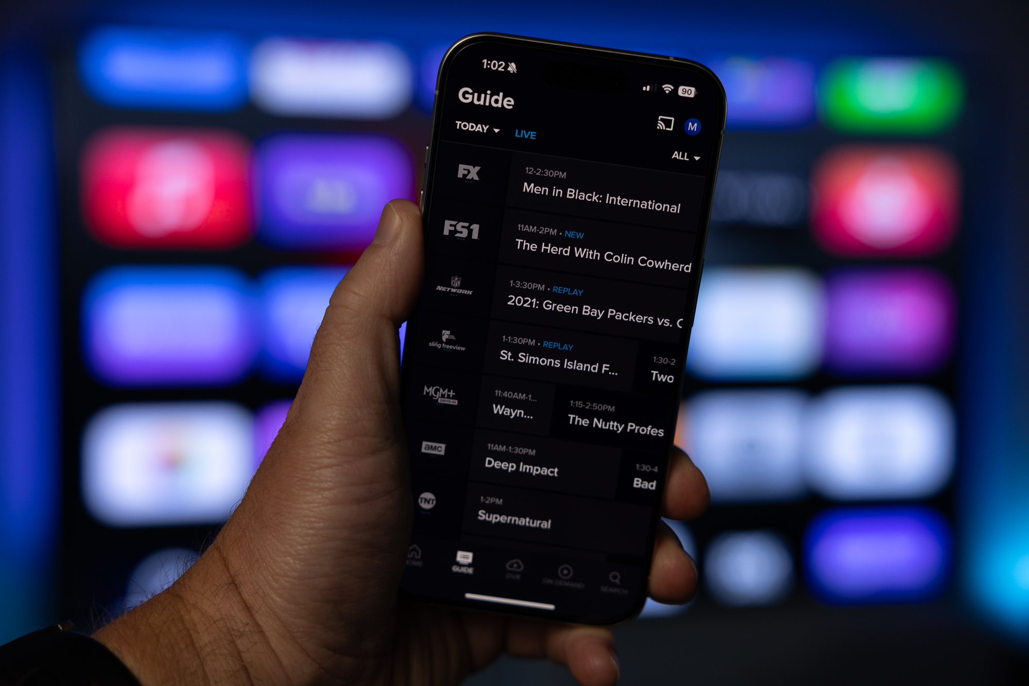 Sling TV guide on an iPhone.