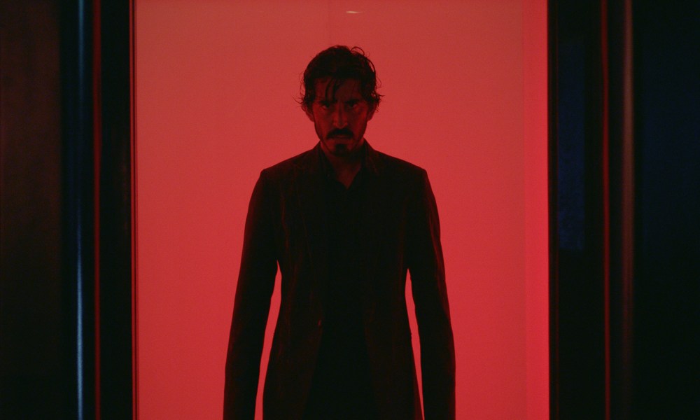 Dev Patel stands in an elevator in Monkey Man.