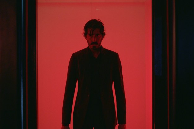 Dev Patel stands in an elevator in Monkey Man.