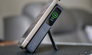 The iPhone 15 Pro Max being charged by the Anker MagGo Power Bank.