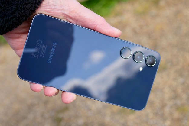 A person holding the Samsung Galaxy A55.