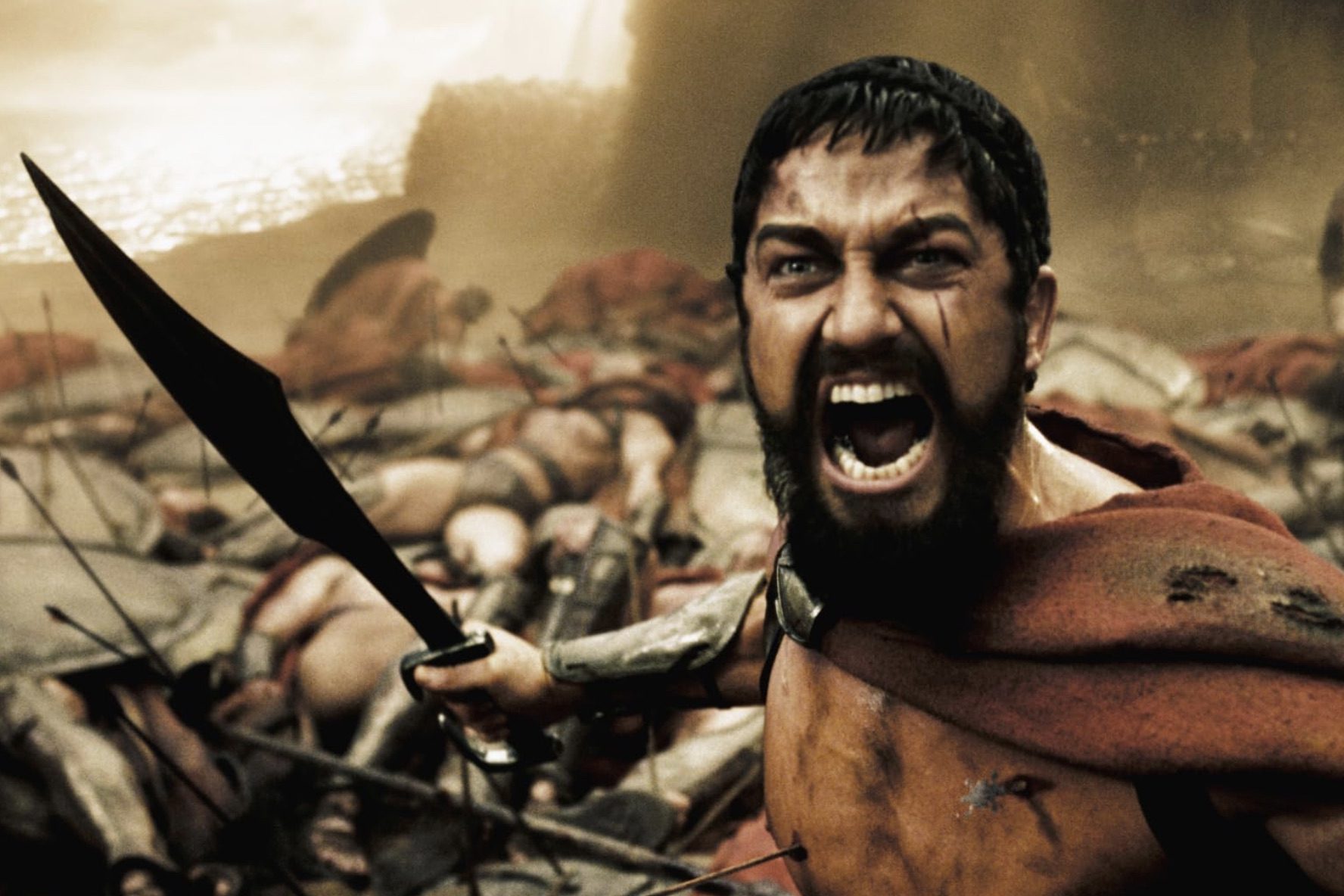 Gerard Butler wields a sword in 300.