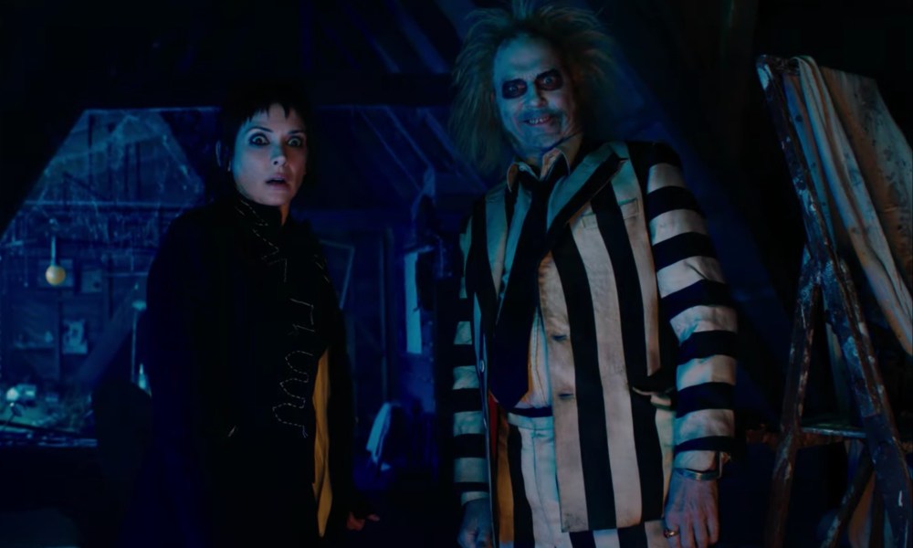 A woman and Betelgeuse stand next to each other with confused looks on their faces.