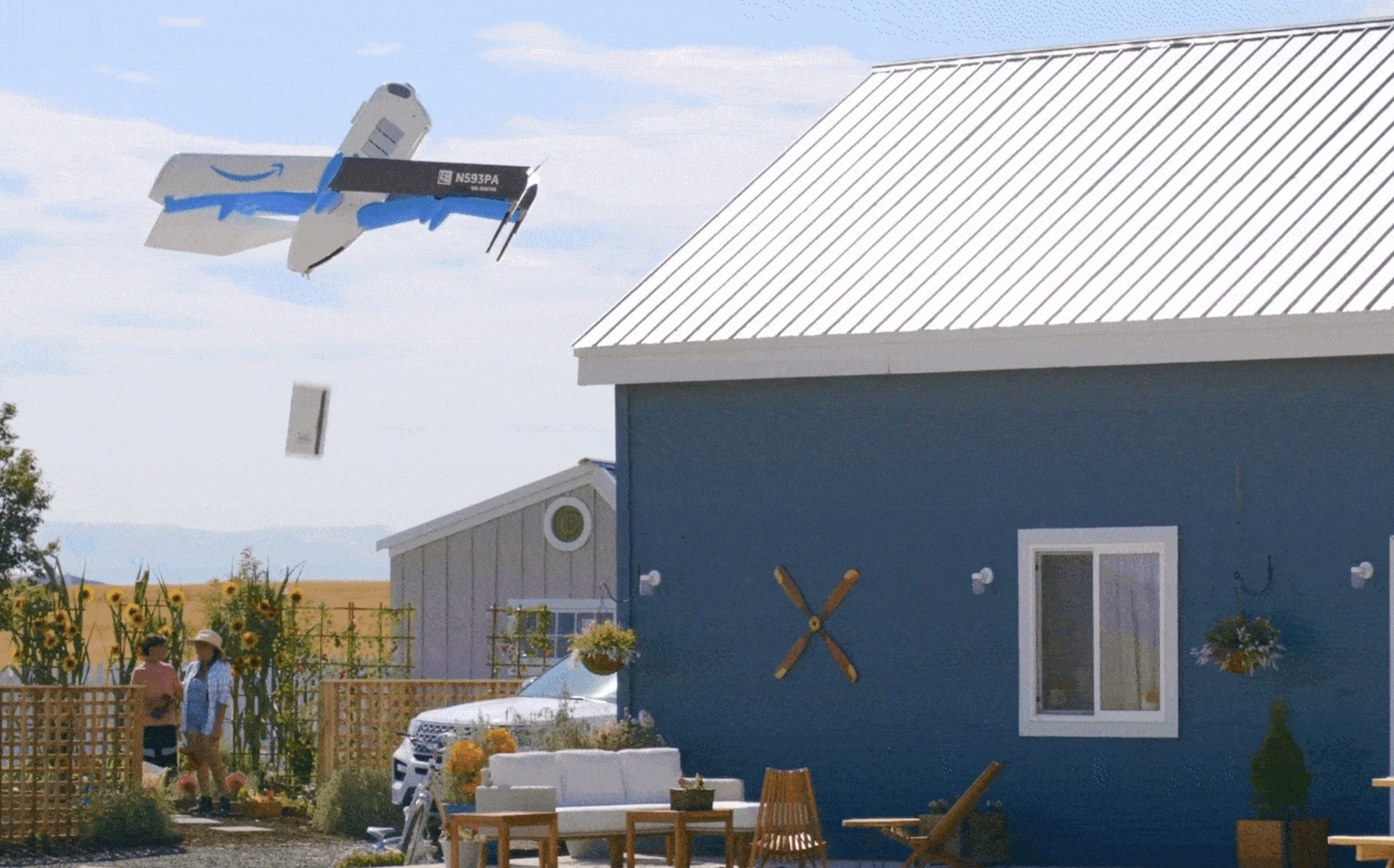 An Amazon delivery drone dropping off a package.