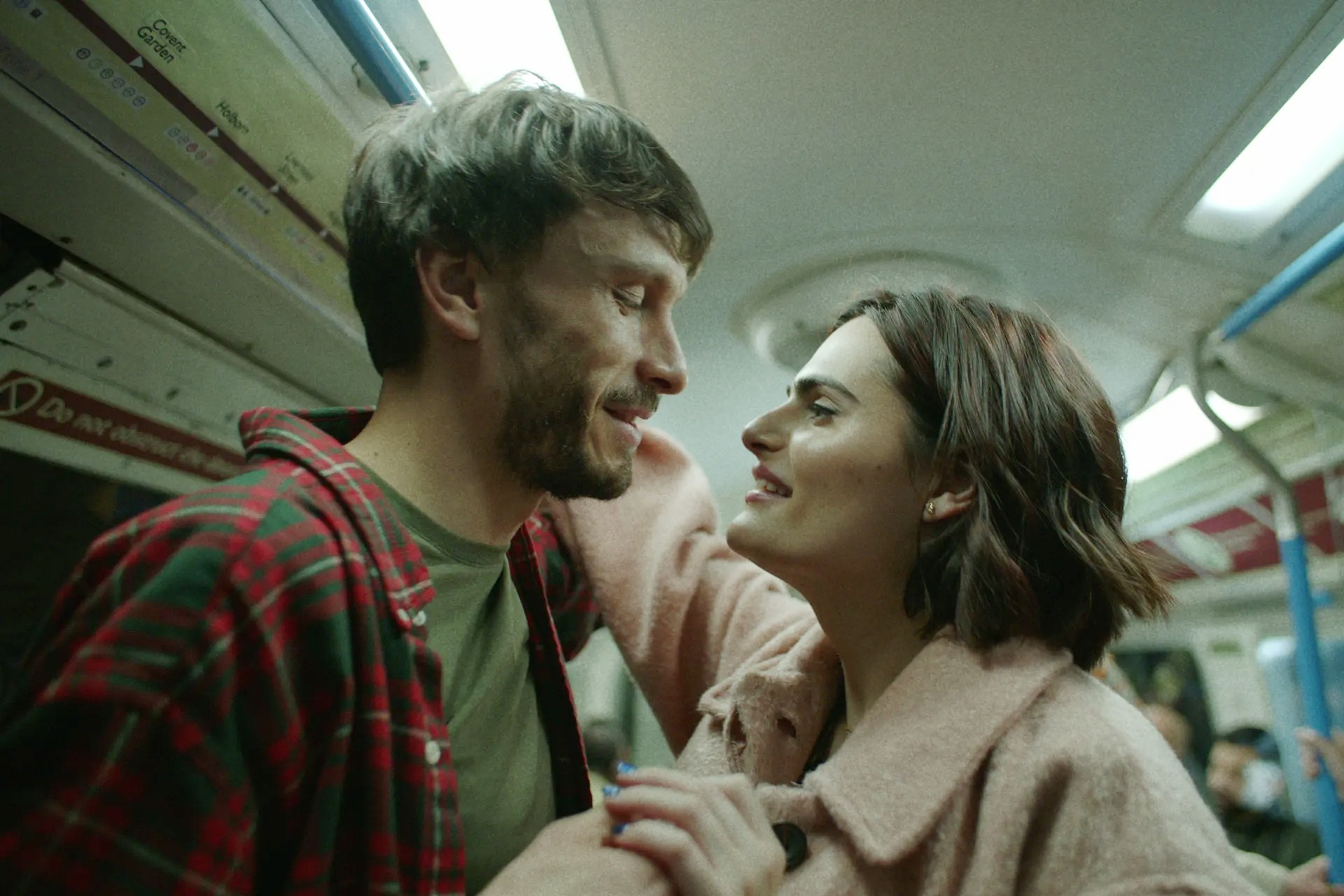 A man and a woman look at each other in Baby Reindeer.