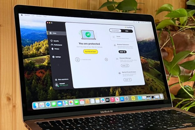 A MacBook Air runs Norton 360 Deluxe antivirus software.