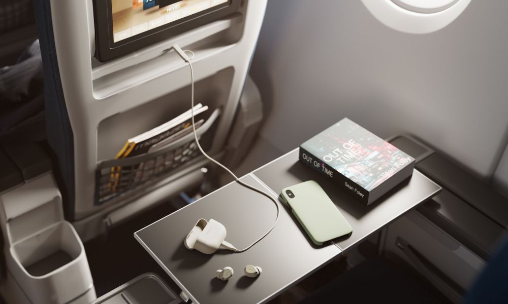 Jabra Elite 10 Gen 2 connected to an airplane seatback entertainment system.