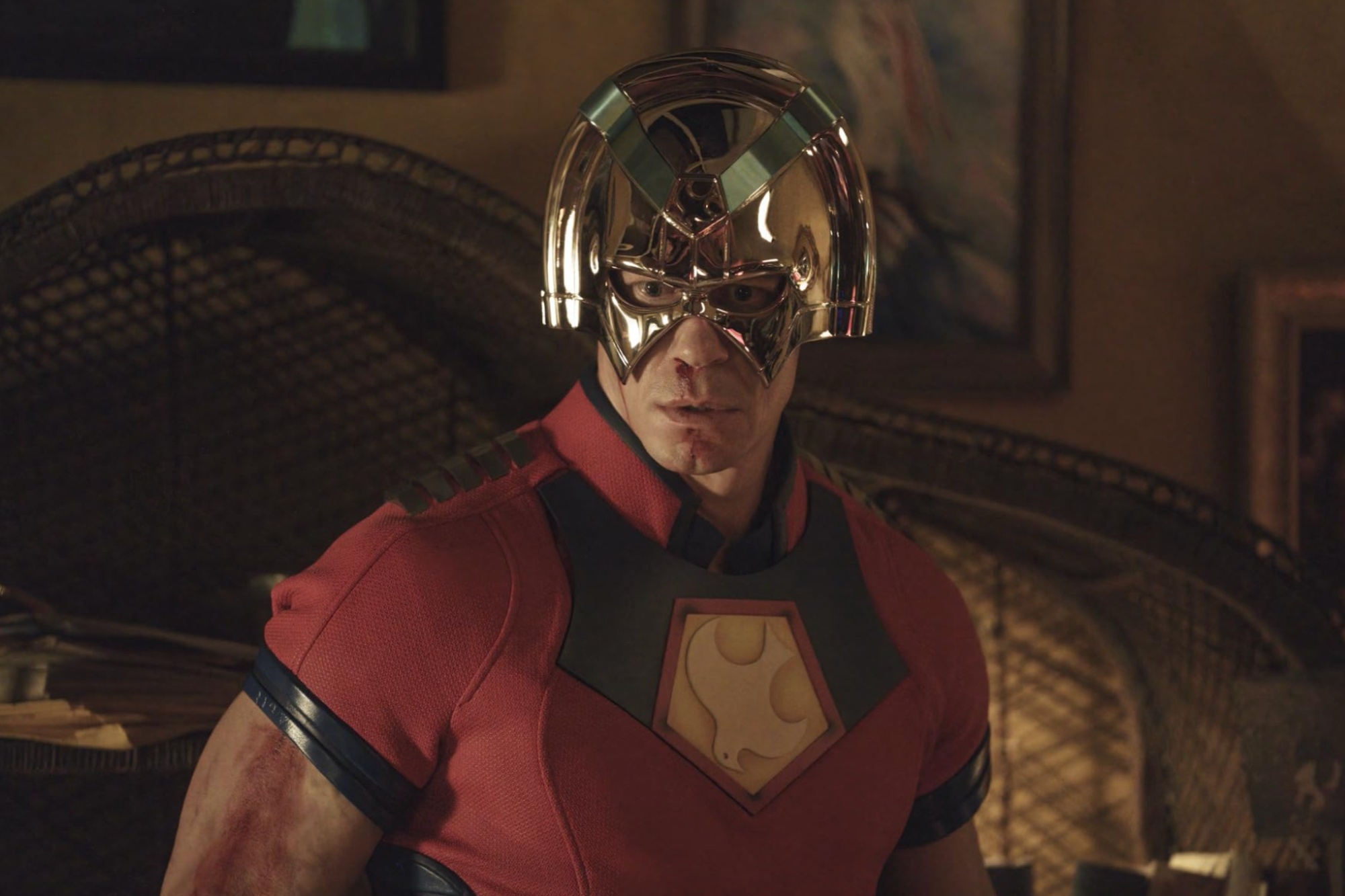 John Cena wears a silver helmet in Peacemaker.