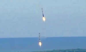 Two Falcon 9 boosters landing after a Falcon Heavy launch.