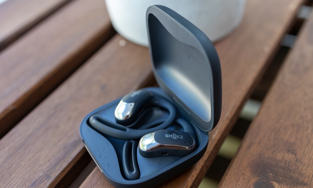 The Shokz OpenFit Air in their charging case.