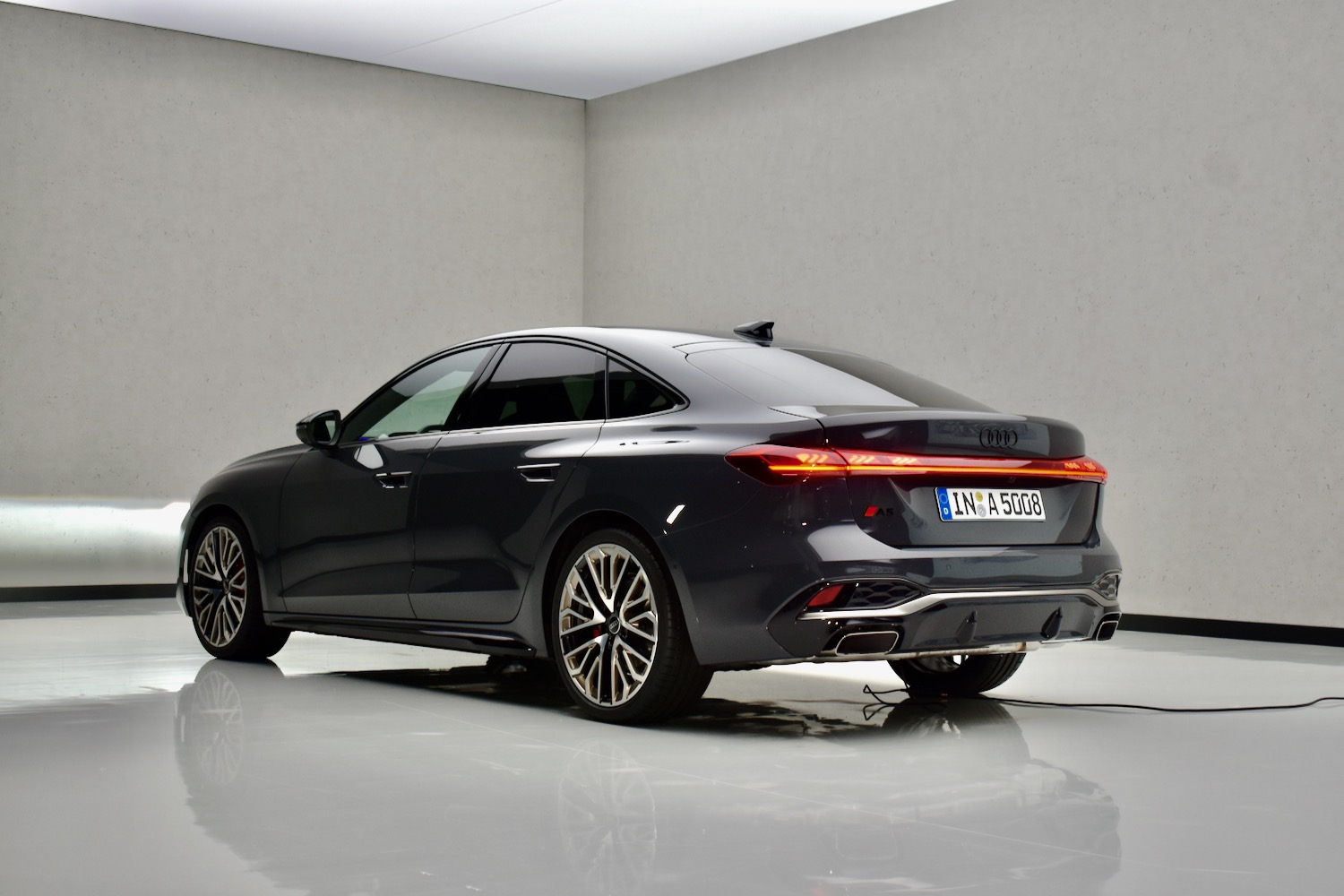 Rear three quarter view of a 2025 Audi A5 sedan.