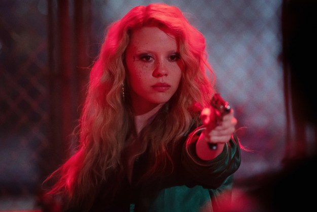 Mia Goth points a gun in MaXXXine.