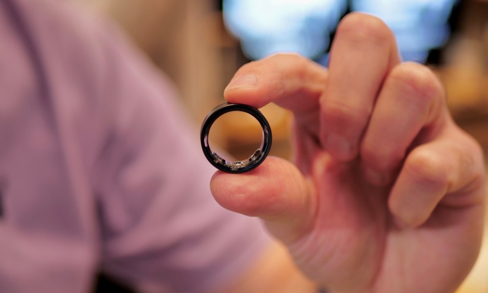 A person holding the Samsung Galaxy Ring.