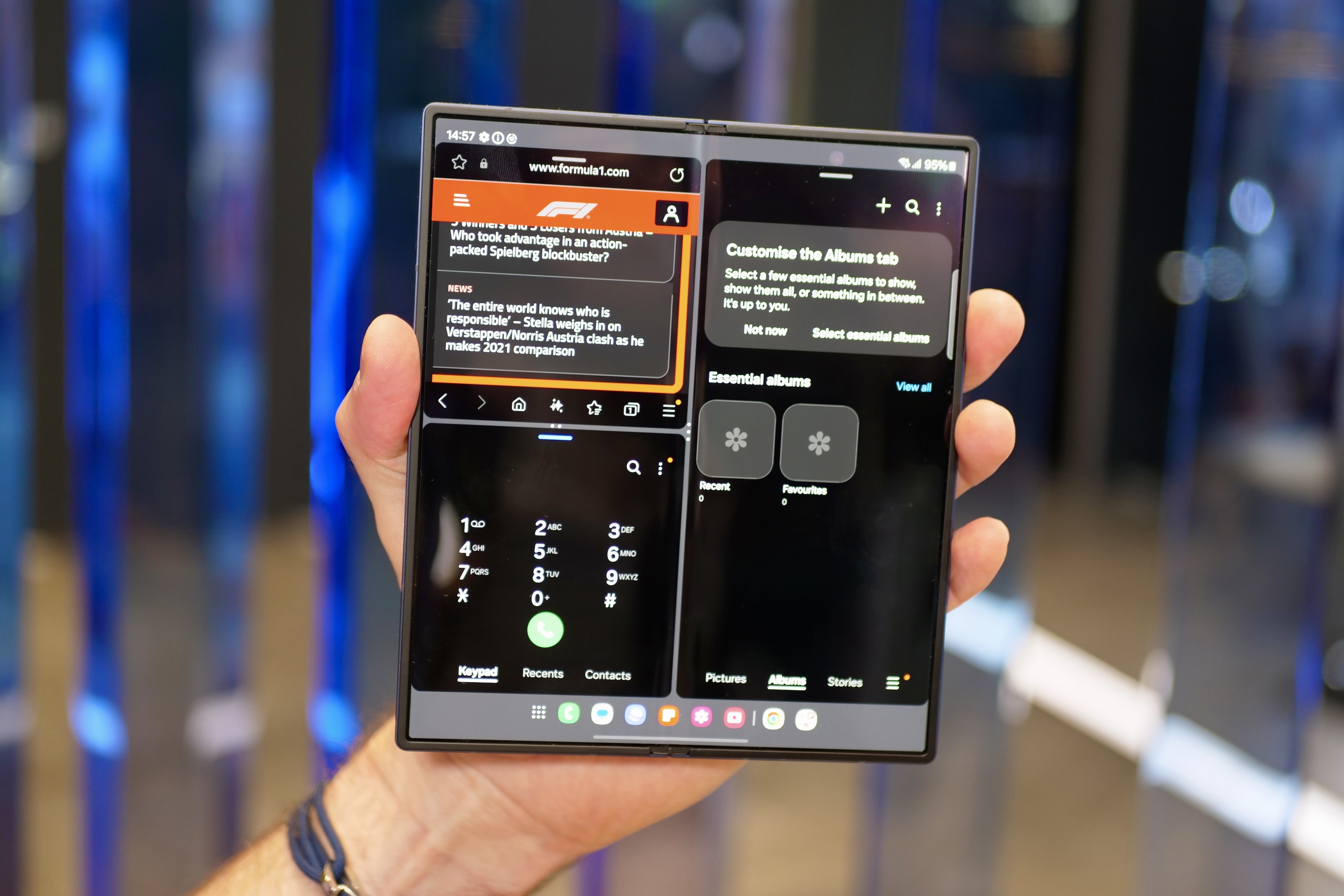 A person holding the open Samsung Galaxy Z Fold6, showing the screen.