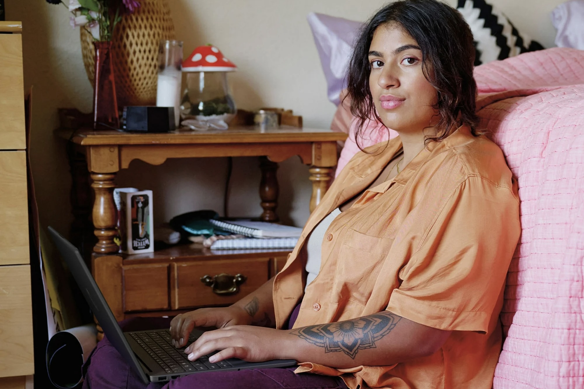 A woman using the HP 15.6-inch N200 Laptop.