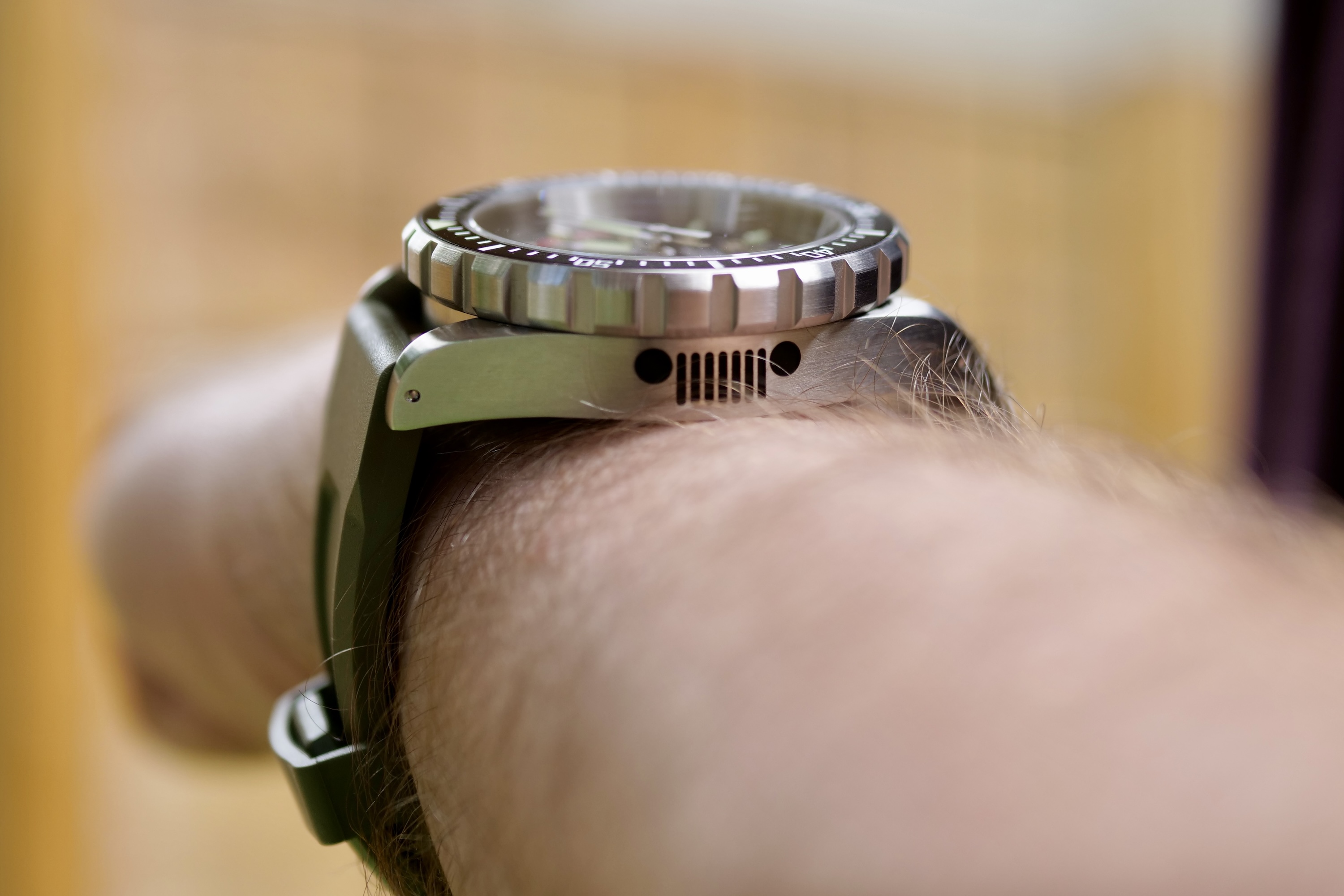 A person wearing the Marathon 41mm Jeep Rubicon GSAR watch.