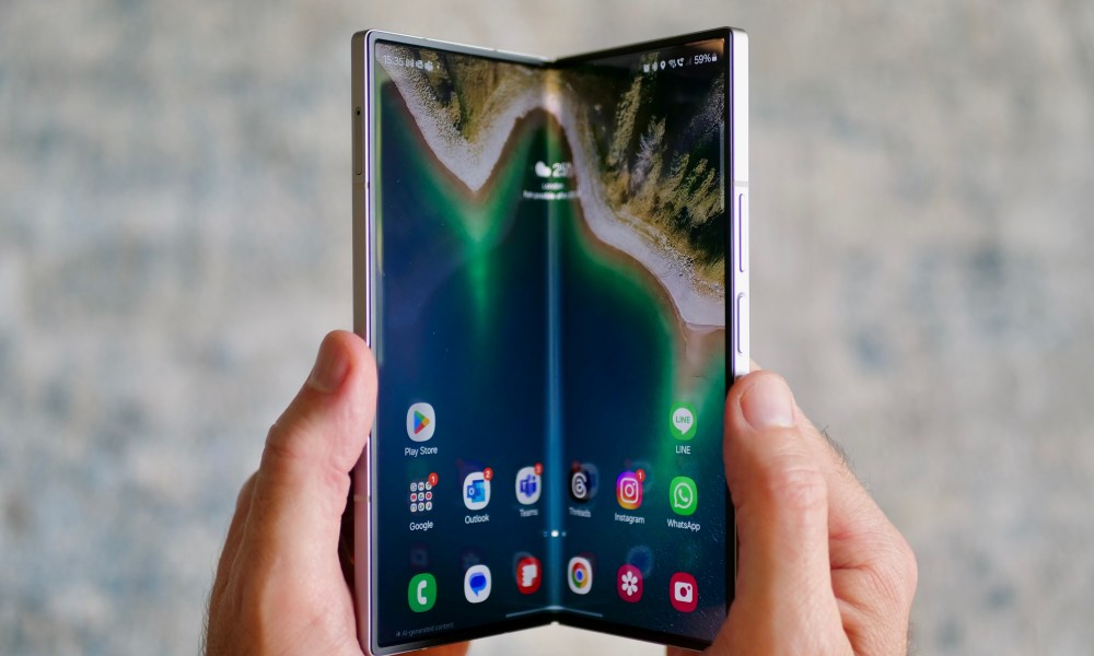 A person opening the Samsung Galaxy Z Fold 6.