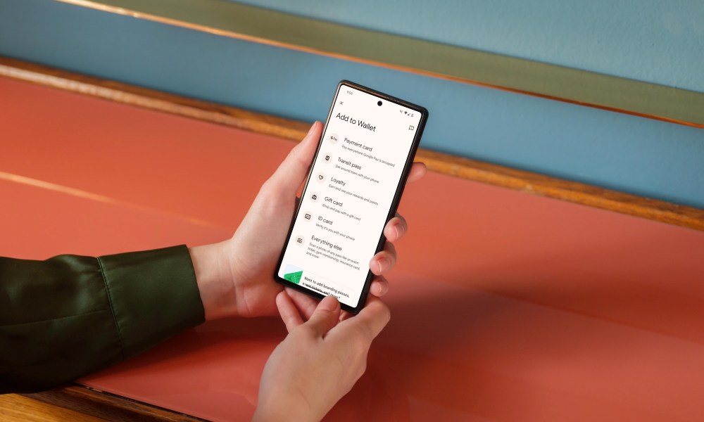 Person holding a phone with Google Wallet opened showing the new Everything Else feature.