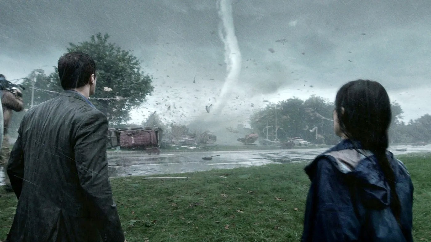 Two people look at a tornado in Into the Storm.