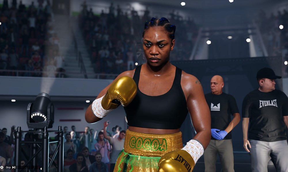 A boxer stands ready, with her trainers behind her in Undisputed.