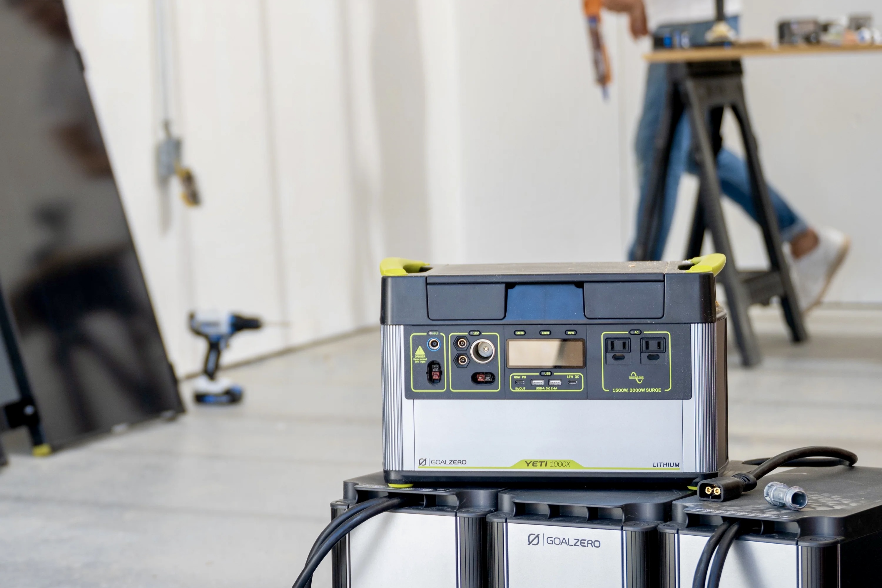 A person using the Yeti 1000X Portable Power Station on a job site.