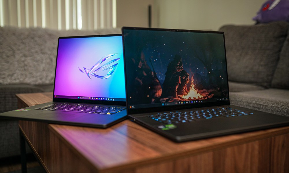 Two Zephyrus G16 laptops sitting next to each other.