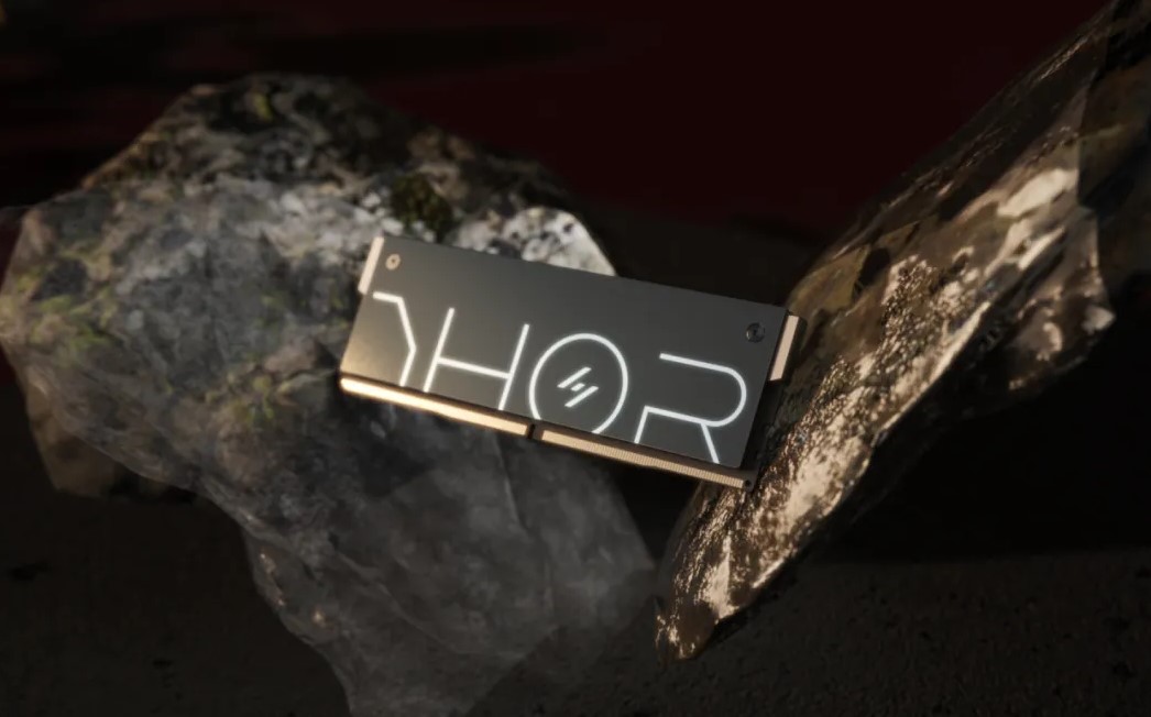 An Asgard THOR RAM stick in front of a rock.