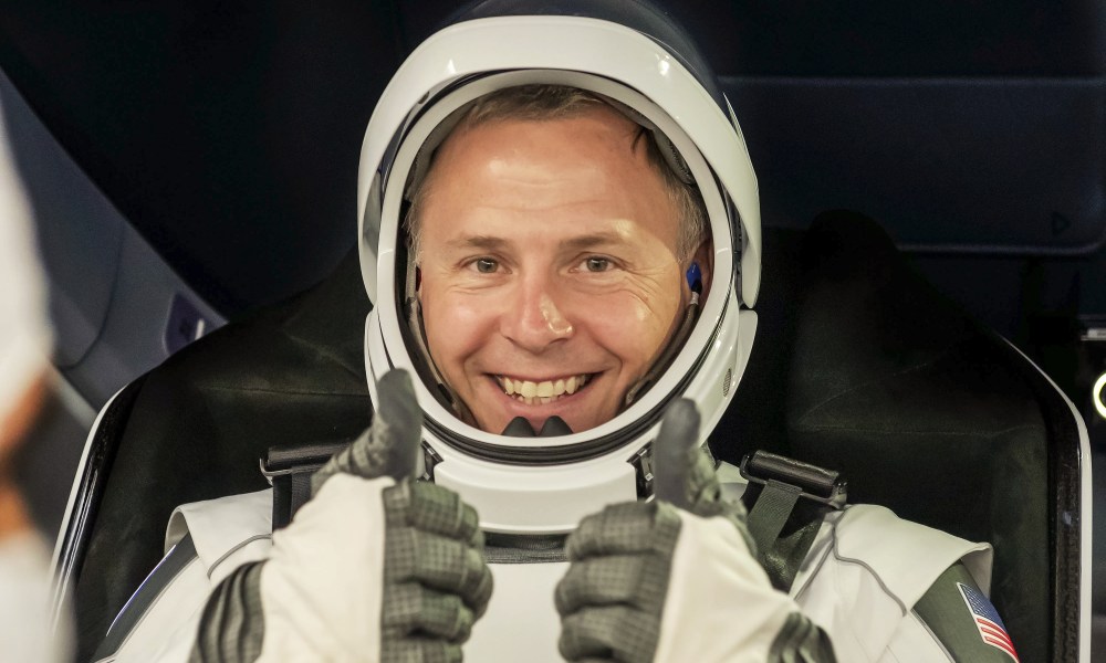 NASA’s SpaceX Crew-9 Commander Nick Hague smiles and gives two thumbs up during the crew equipment interface test at SpaceX’s Dragon refurbishing facility at Kennedy Space Center in Florida.