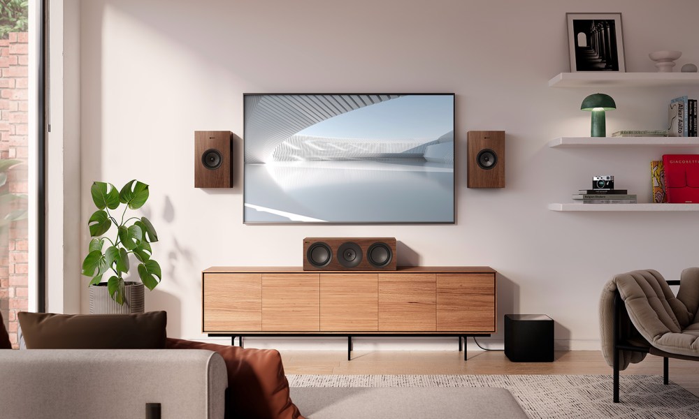 The KEF Q4 Meta on-wall speakers with a Q6 Meta center-channel speaker.