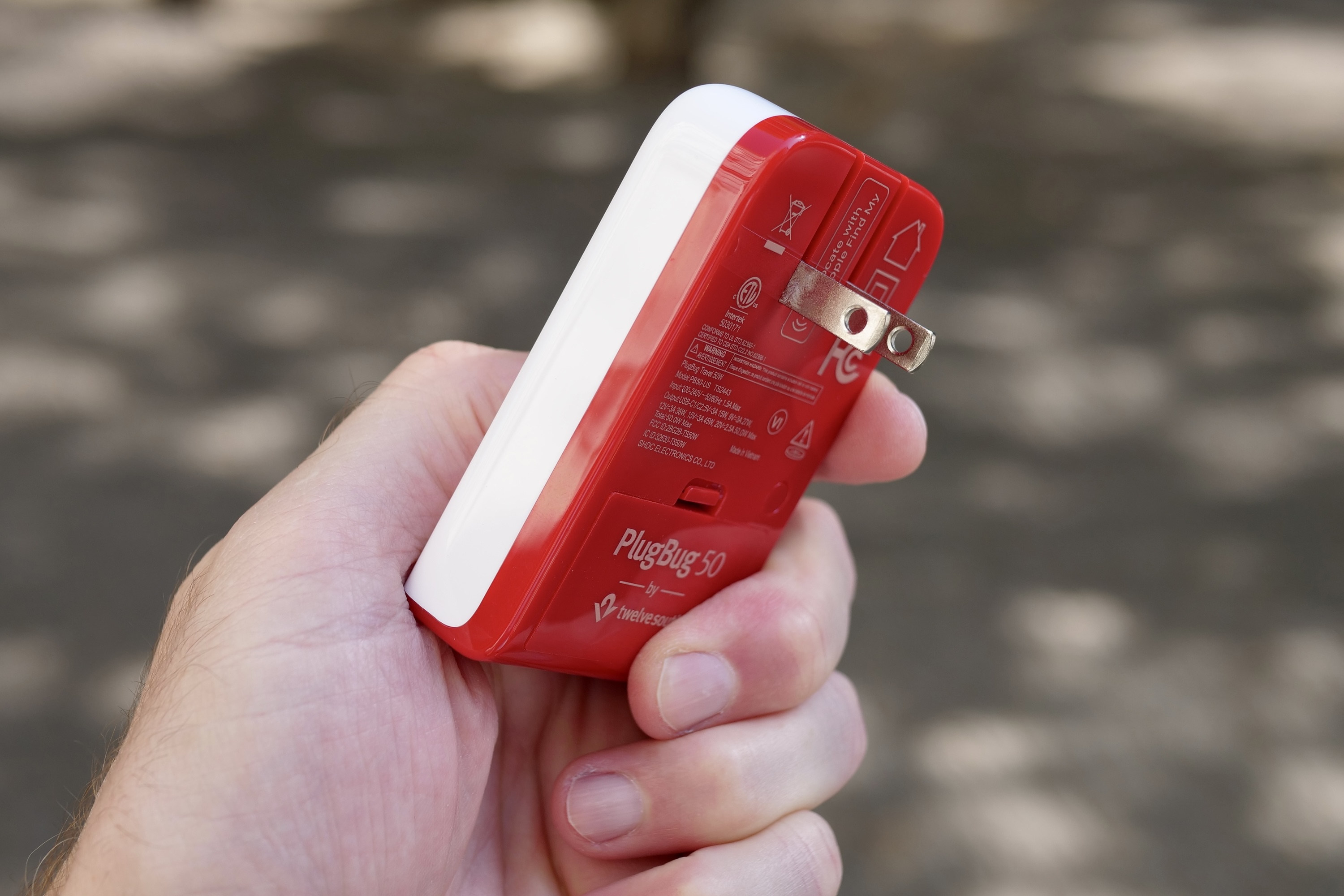 A person holding the PlugBug charger.