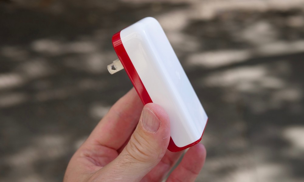 A person holding the PlugBug charger.