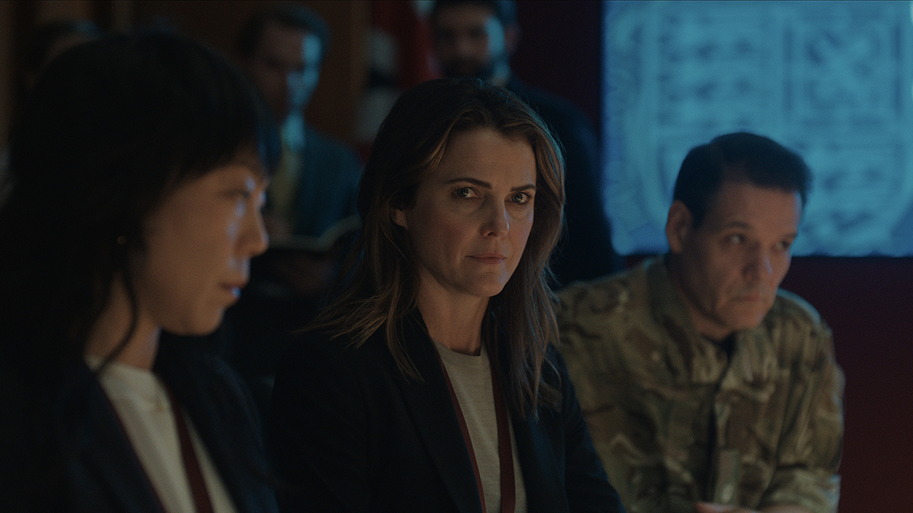 Keri Russell flanked by two others in a White House room in The Diplomat.