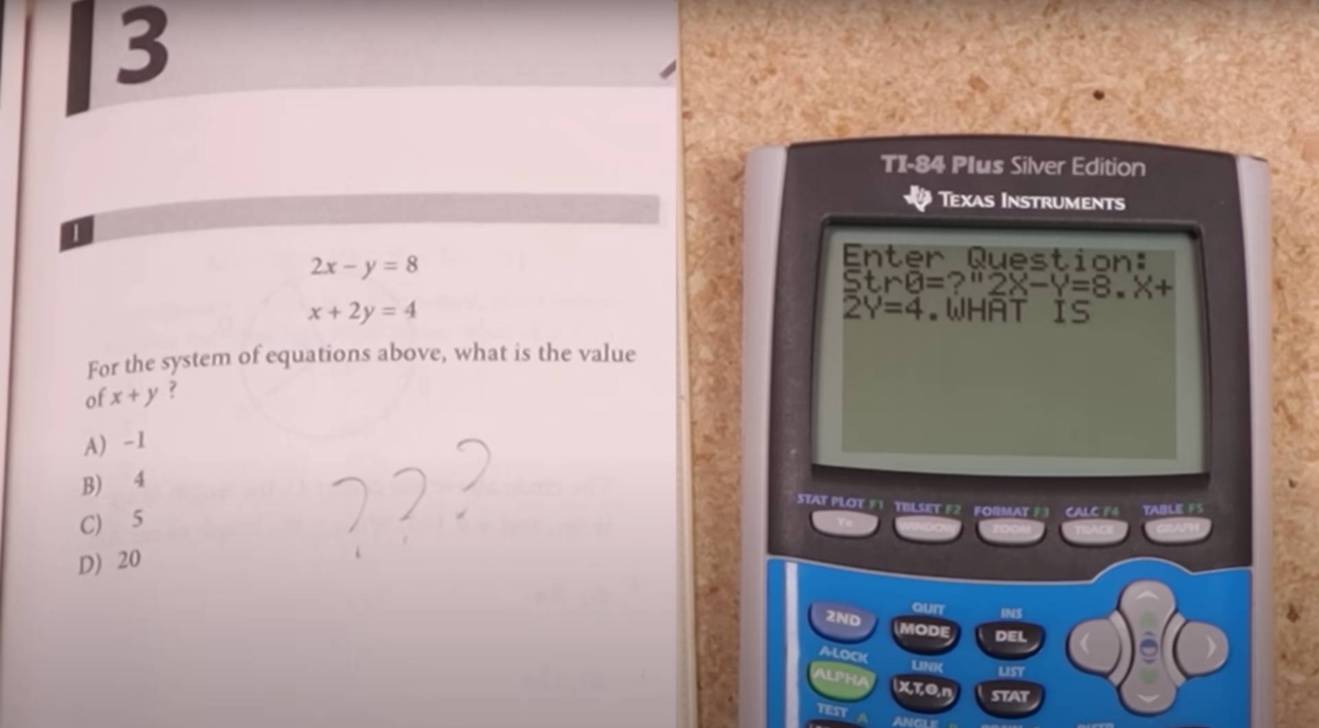 A TI-84 calculator displayed next to a calculus textbook