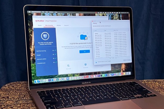 McAfee+ Premium's Total Protection app is open on a MacBook Air.