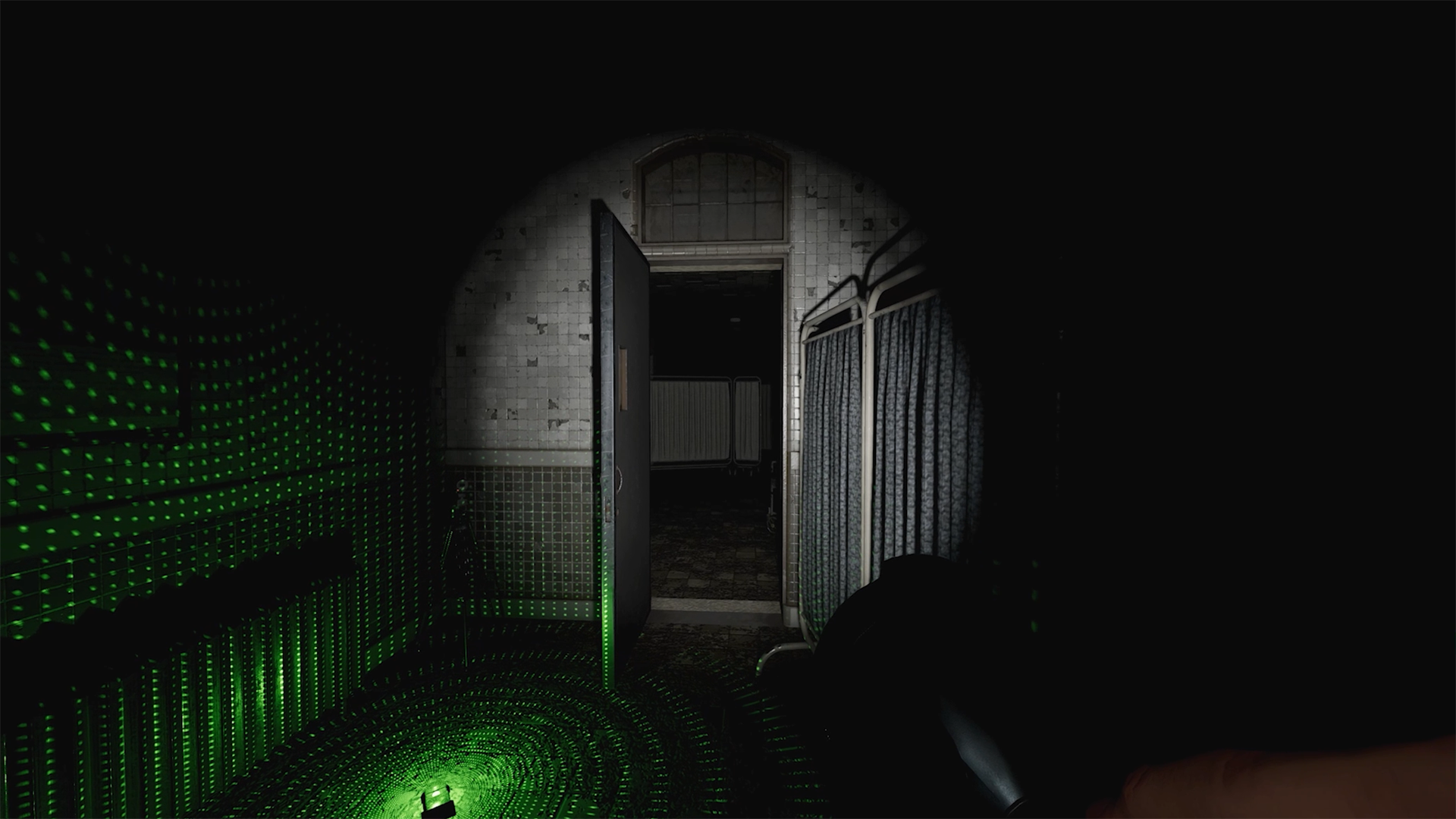 A flashlight shines on a hallway in Phasmophobia.