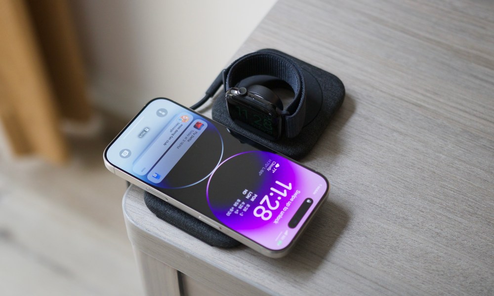 An iPhone and Apple Watch on the Belkin BoostCharge Pro Travel Pad.