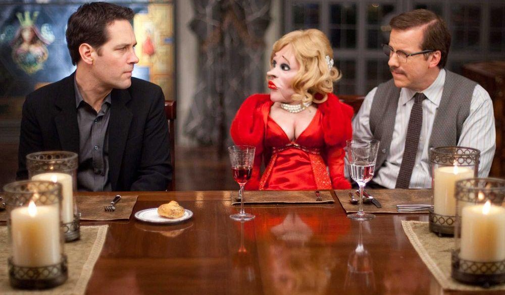 A man looks at a puppet in Dinner for Schmucks.