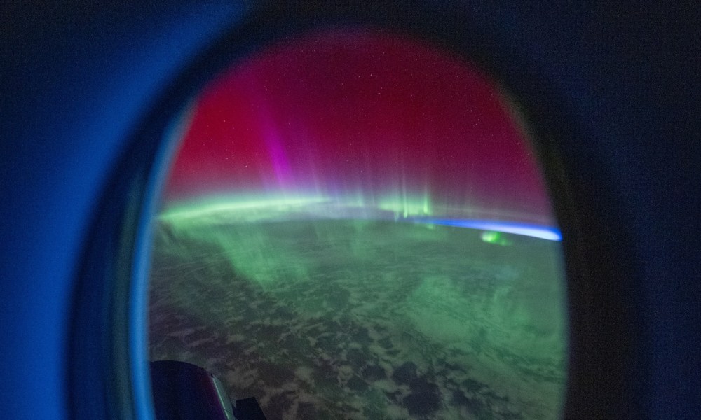 An aurora as seen from a Crew Dragon spacecraft docked at the ISS.