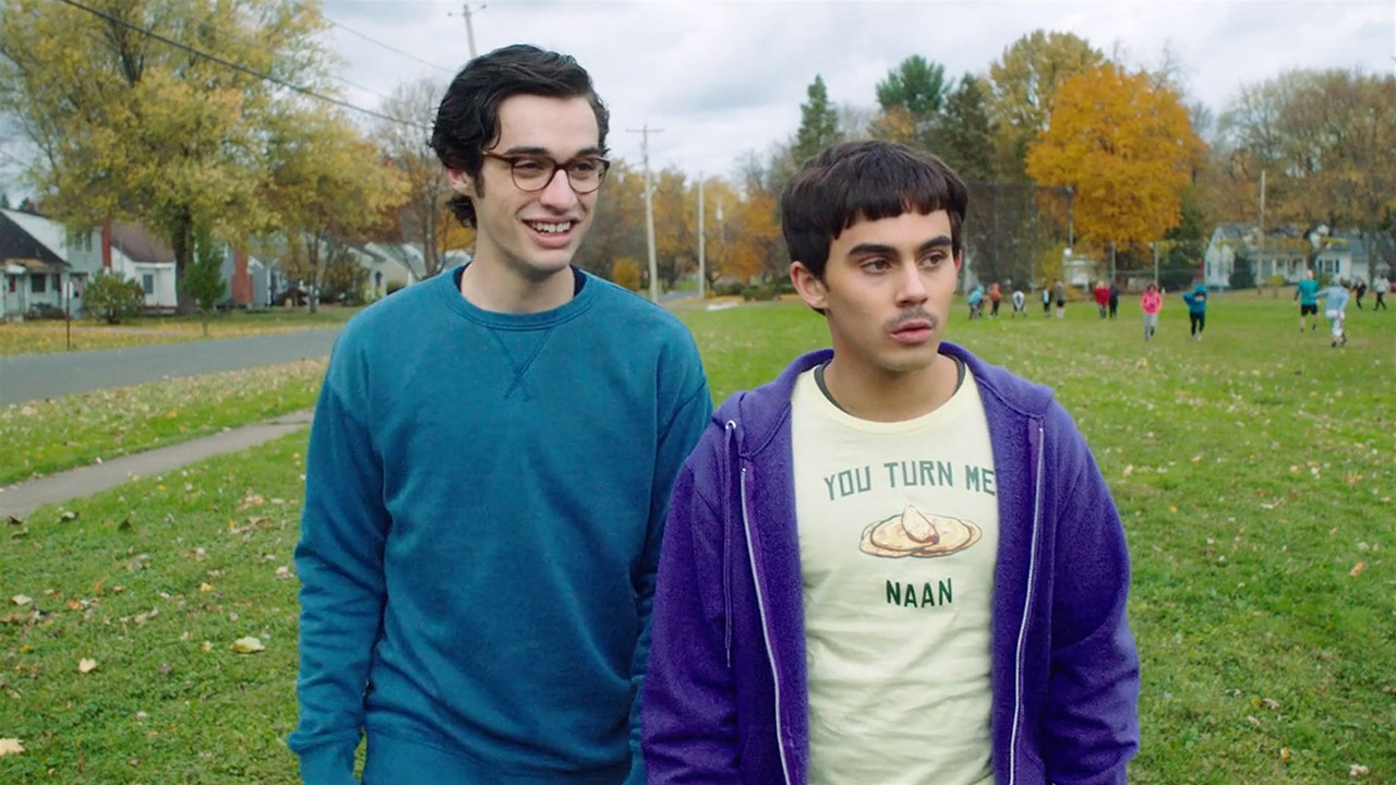 Two nerdy young men standing in a field outside in Sid is Dead.