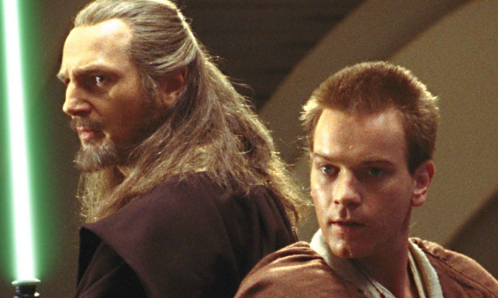 Liam Neeson and Ewan McGregor stand back to back in Star Wars: Episode I - The Phantom Menace.