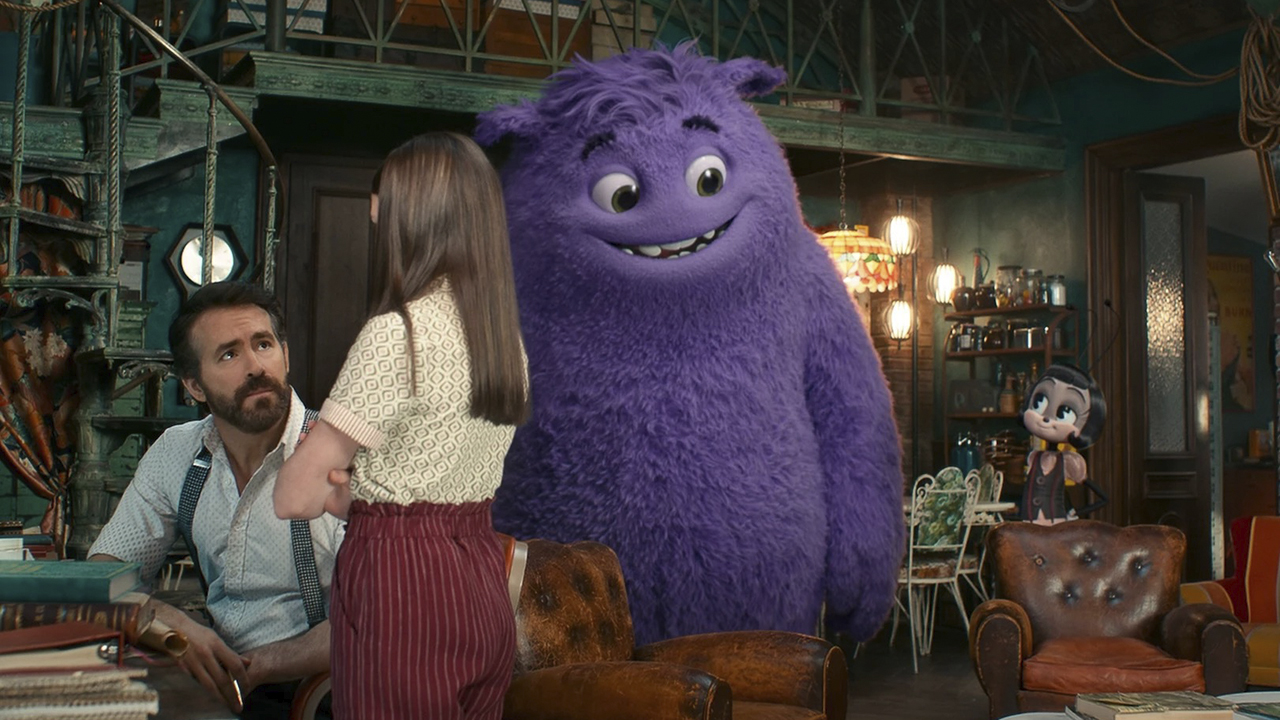 Ryan Reynolds with a large purple creature talking to a young girl in IF.